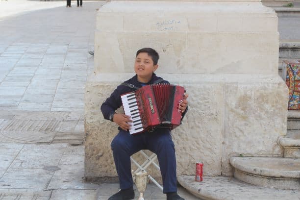 Our young friend playing accordion near the steps of the cathedral (Photo: Brent Petersen)