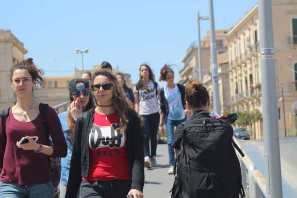 Young people enjoying a walk across the bridge to Ortigia (Photo: Brent Petersen)