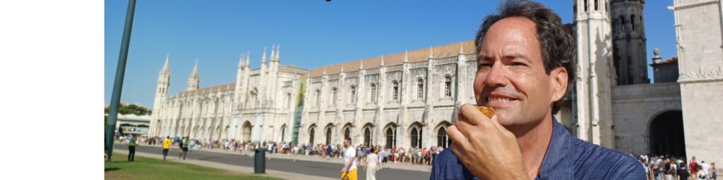 Man eating pastry by Jernimos Monastery.