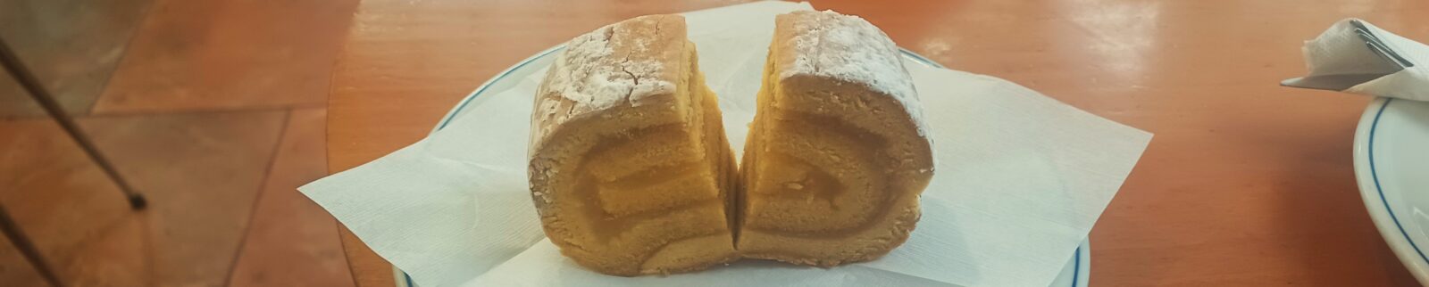 A piece of cake sitting on top of a white plate.