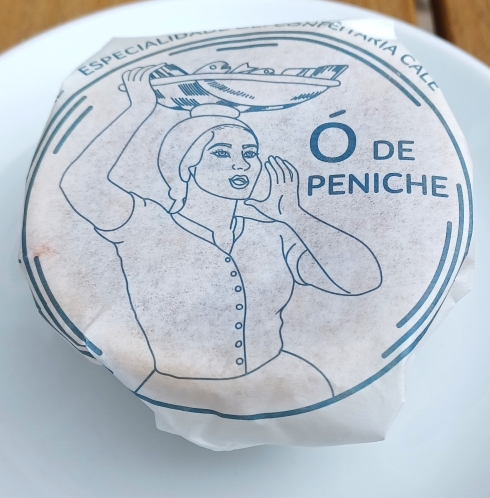 A paper wrapper with an illustration of a woman holding something.