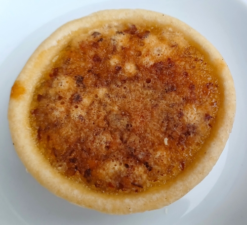 A close up of a pie on top of a plate.