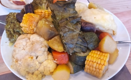 A plate of food with vegetables and rice.